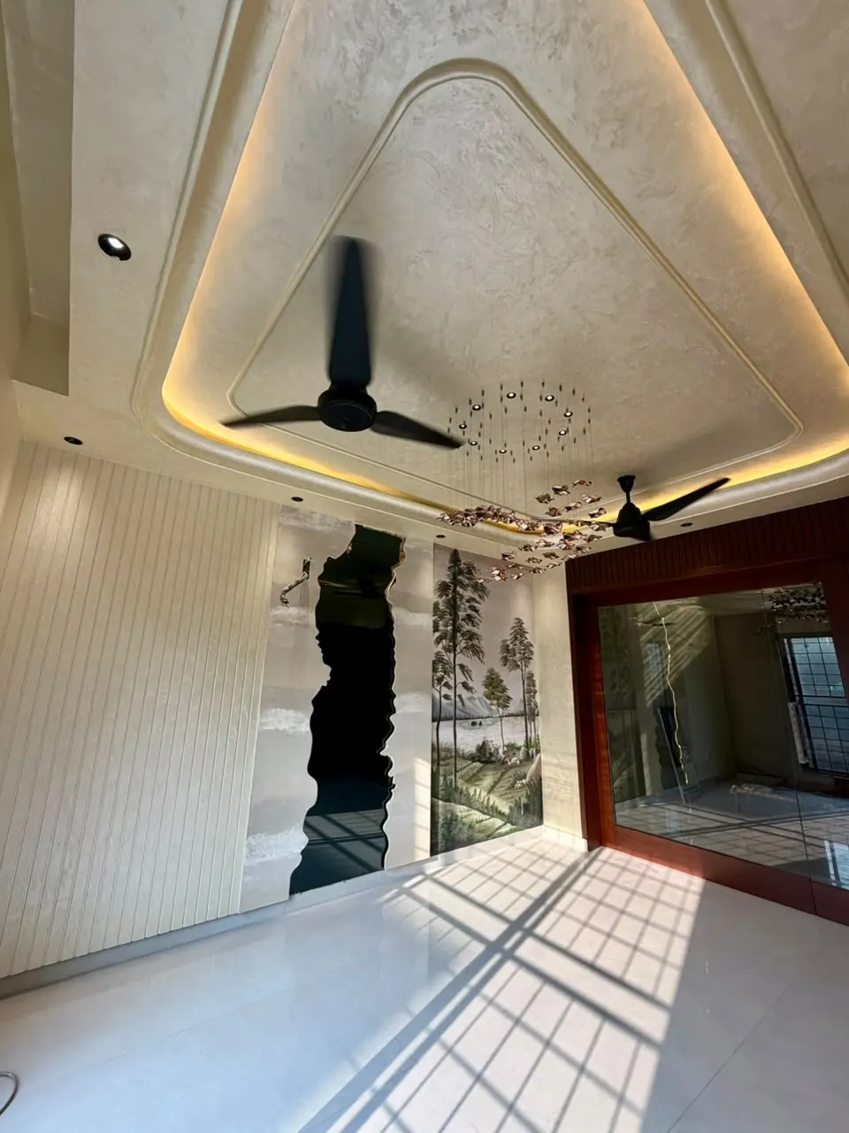 Drawing room with mural feature wall and false ceiling