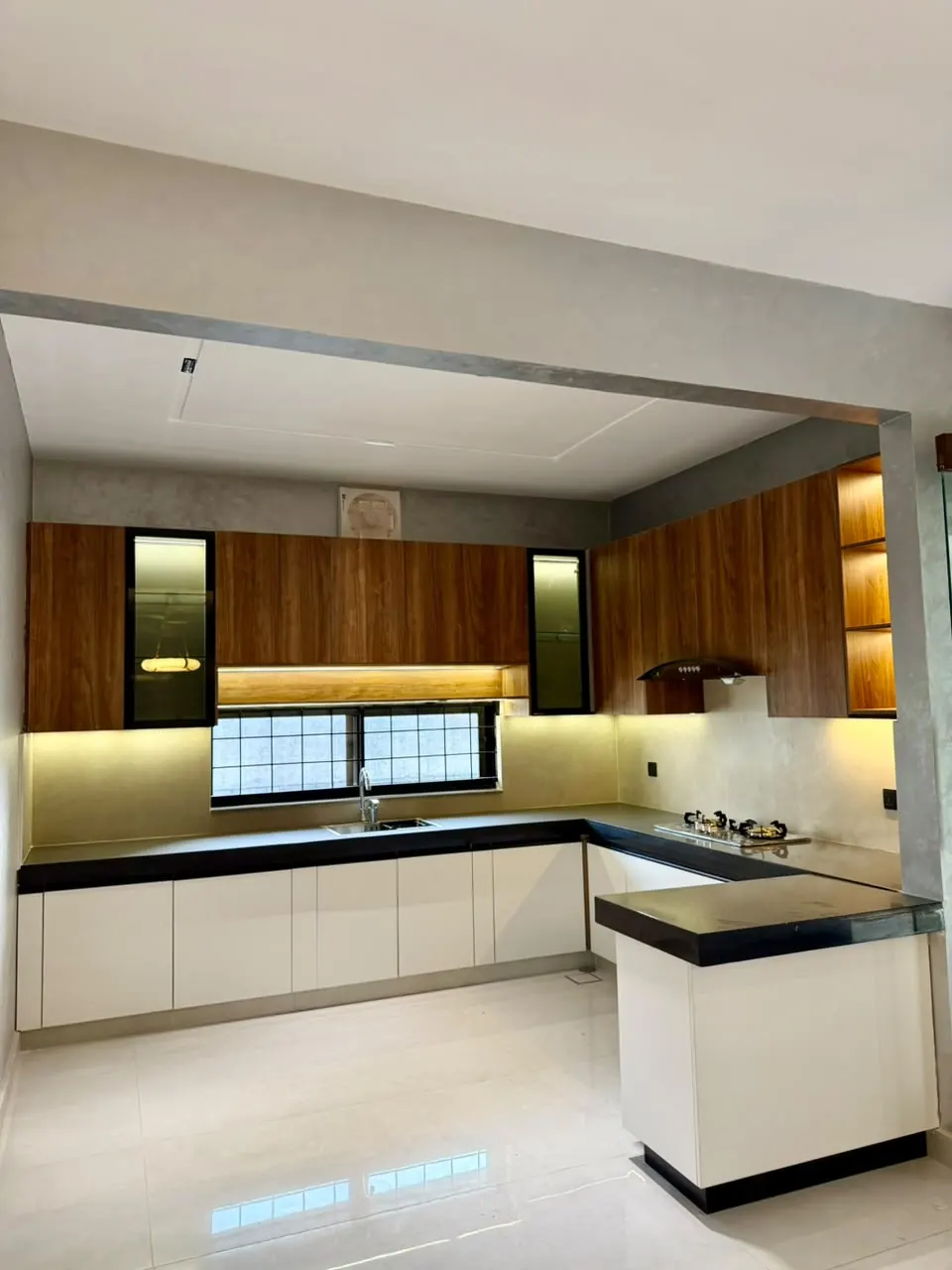 Modern kitchen with wooden and white cabinets