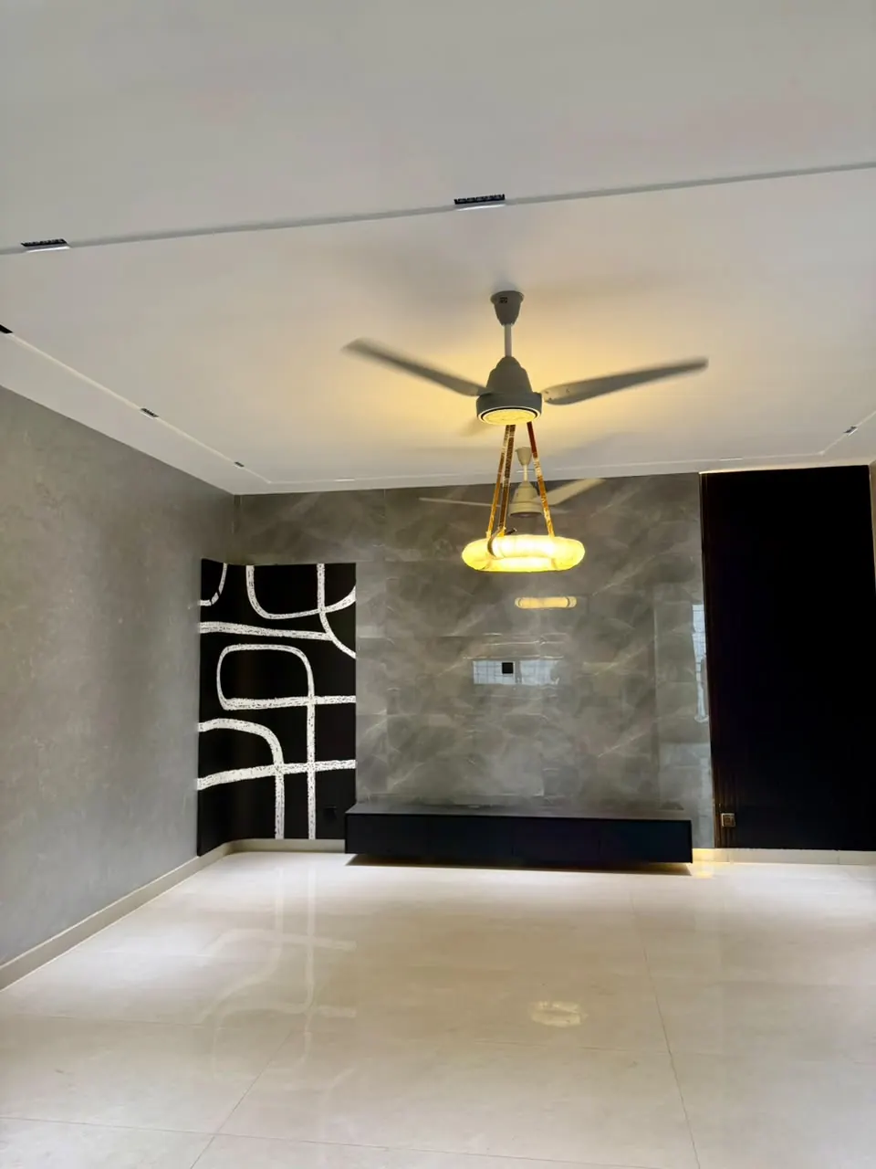 Lounge with stone-finish TV wall