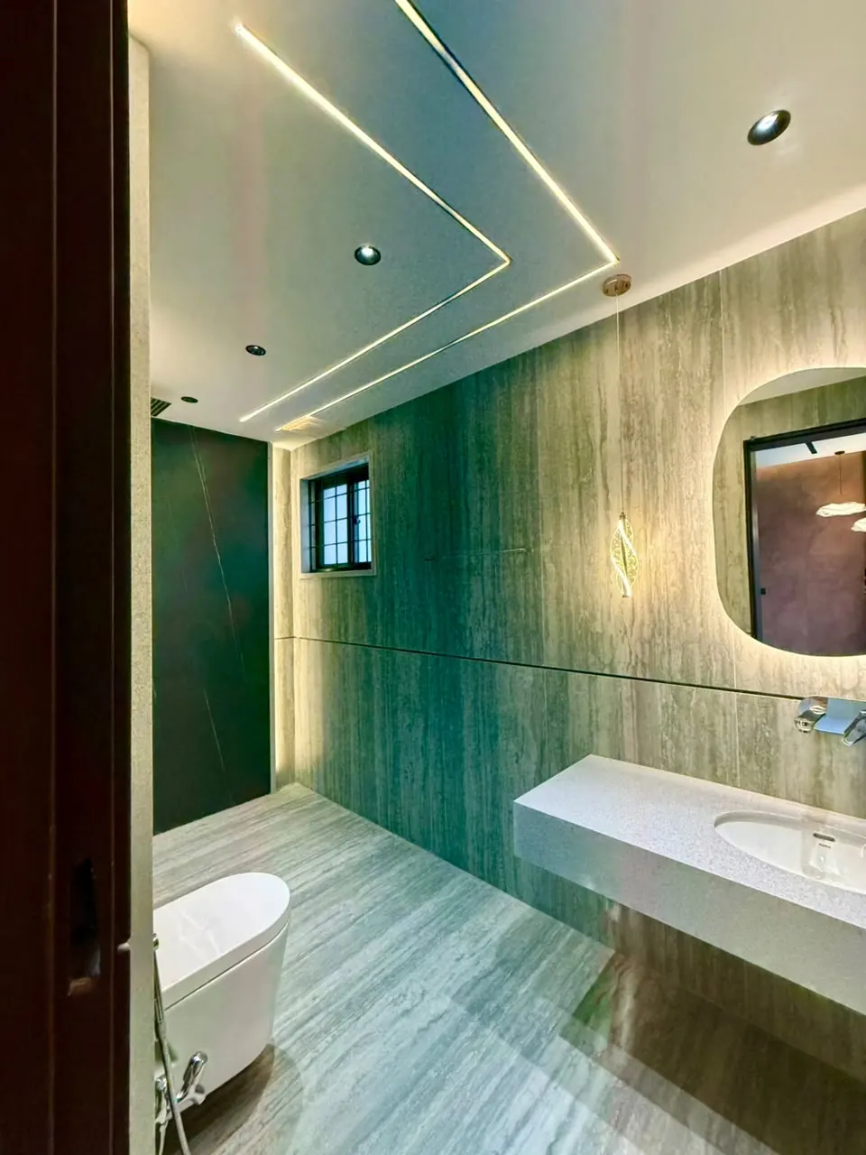 Bathroom with bathtub and stone wall tiles