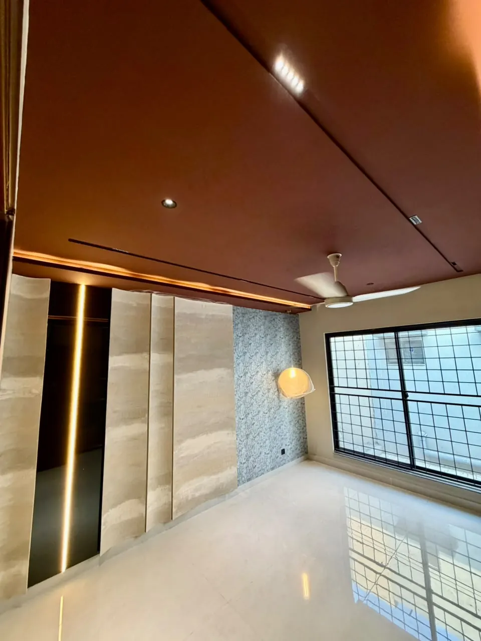 Bedroom with wooden ceiling and large window