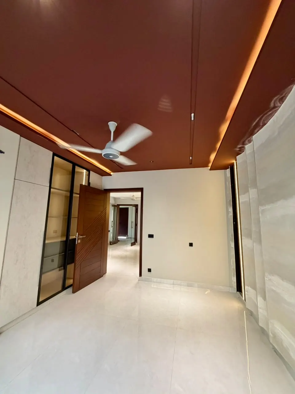 Bedroom with glass-front dressing area