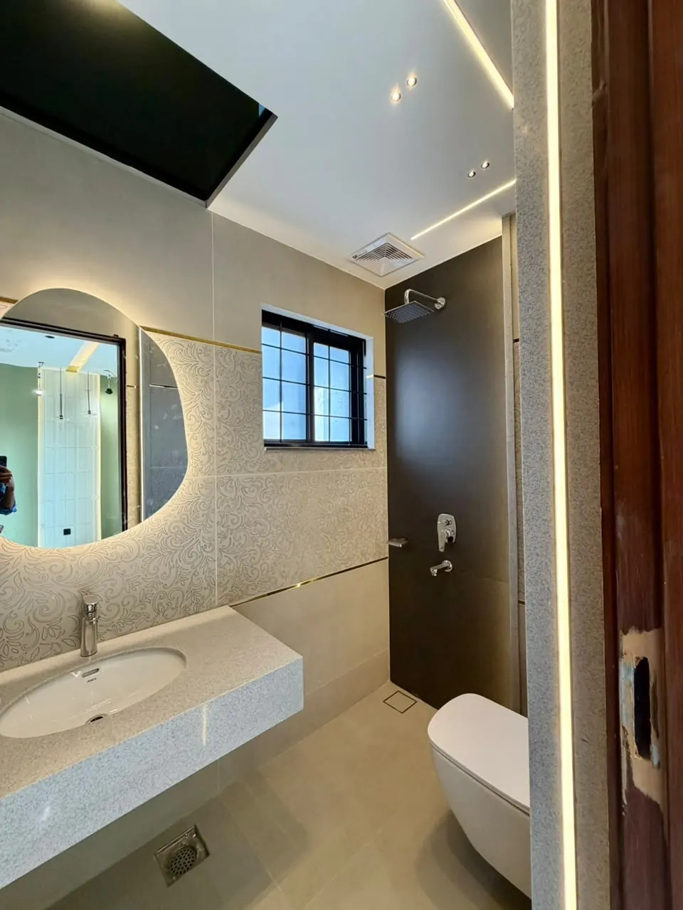 Bathroom vanity with backlit mirror