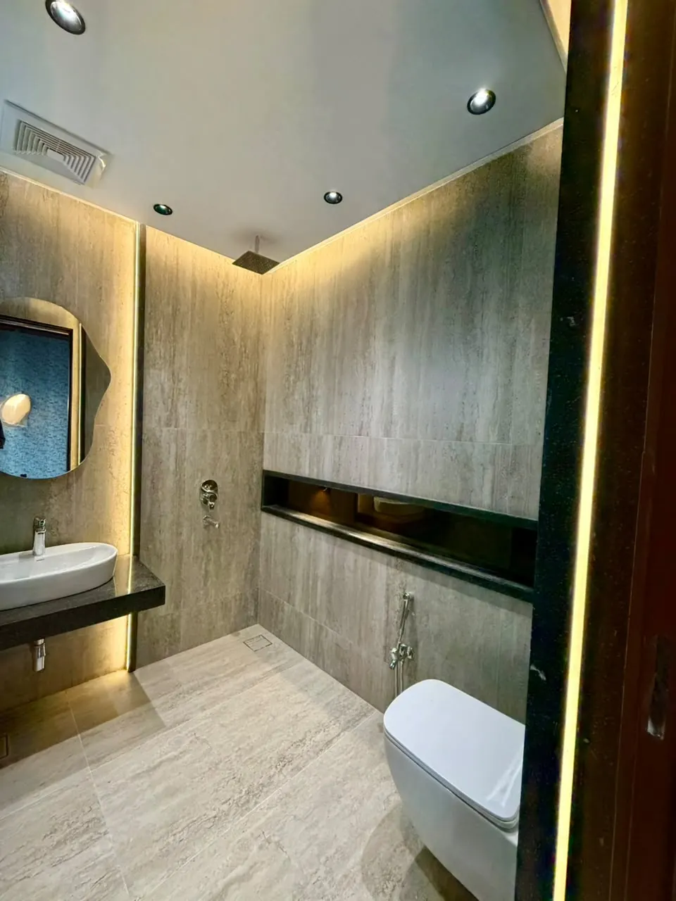 Bathroom with lit wall niche